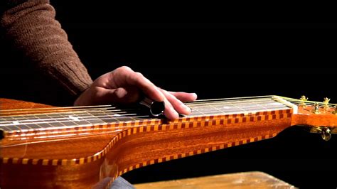 How to Play a Lap Steel Guitar: A Journey Through Strings and Imagination